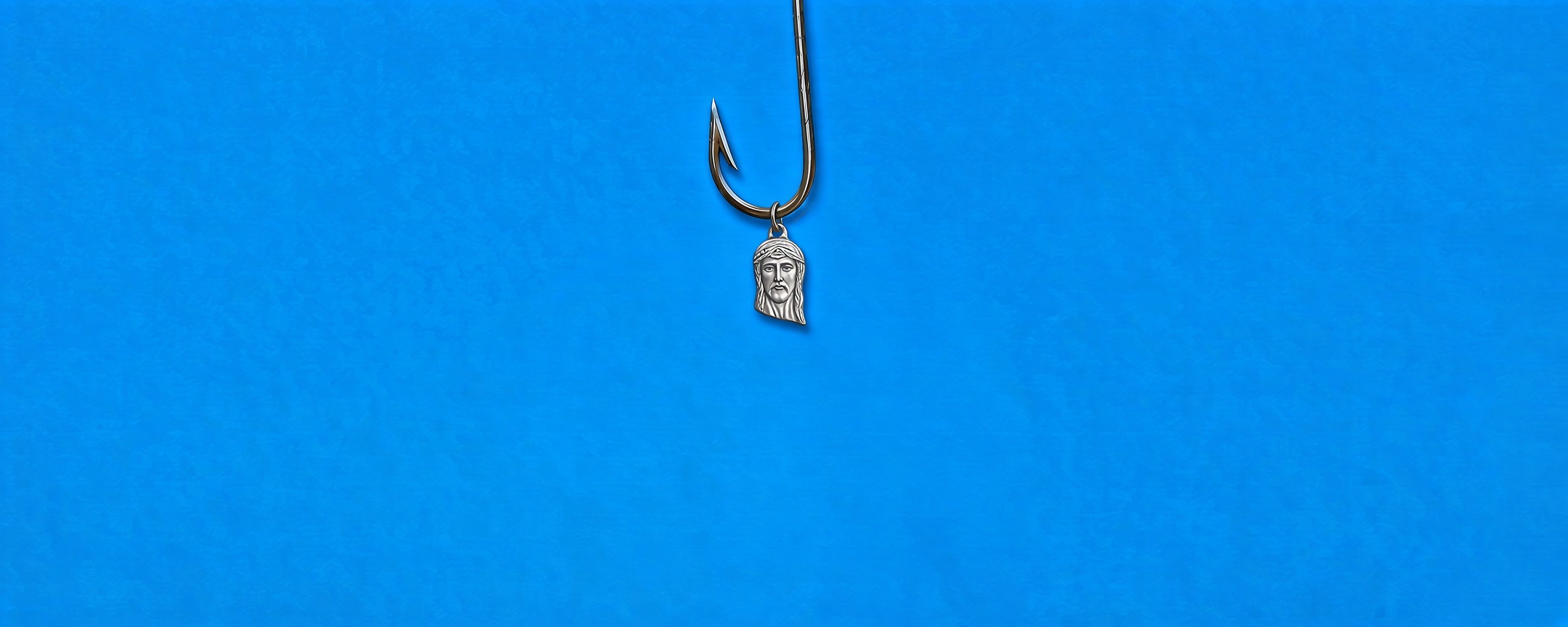 A fishing hook and a small charm on a vivid blue background